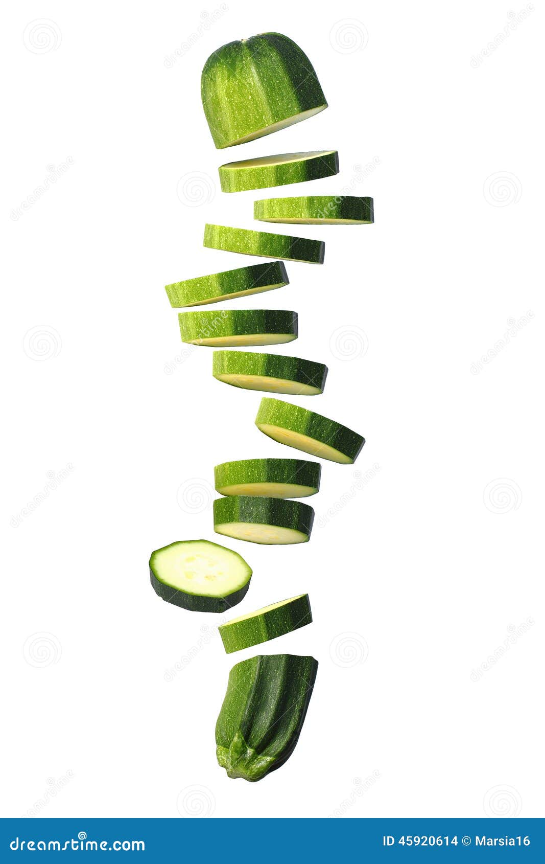 sliced courgette (zucchini) flying on white