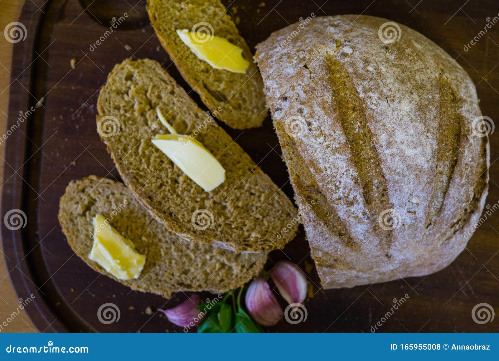 Sliced Fresh Bread with Slices of Butter and Garlic Cloves Stock Photo Image of wood, butter
