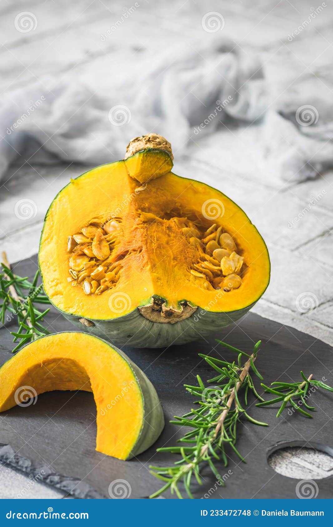 sliced green sombra pumpkin, cucurbita maxima, on gray background