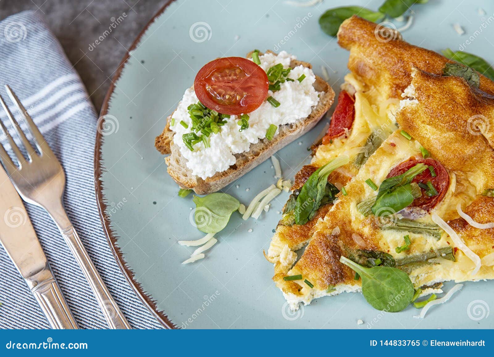 Sliced Pieces of Omelet with Bread on a Plate. Omelet in the Oven with ...