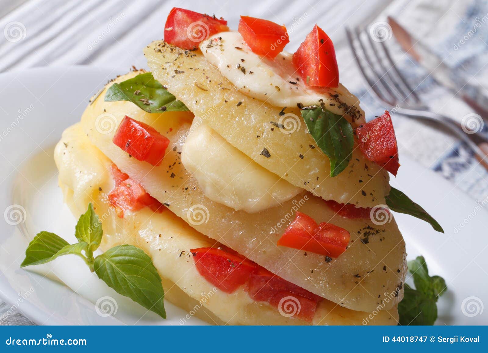Sliced Potatoes Baked with Mozzarella, Tomato Horizontal Stock Image