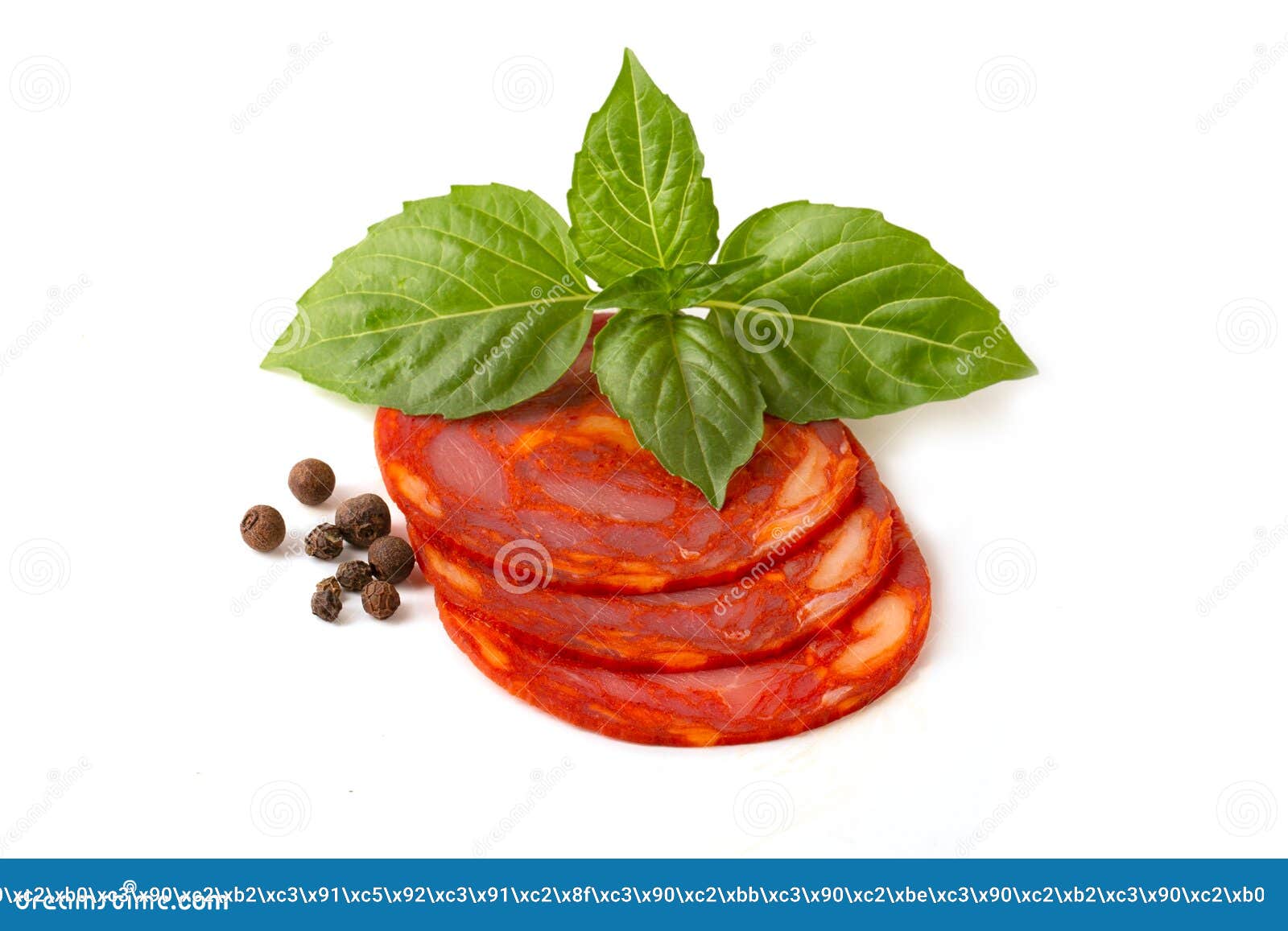 sliced round pieces of raw-cured chorizo sausage with basil leaf and pepper peas on a white background