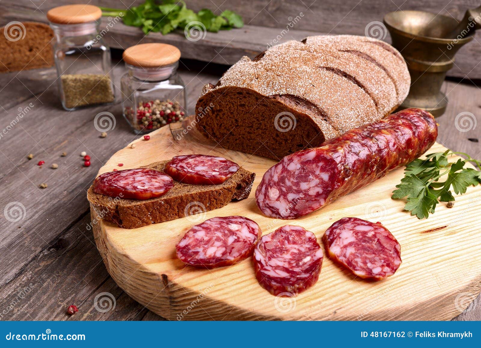Sliced salami and bread stock photo. Image of board, cacciatorini