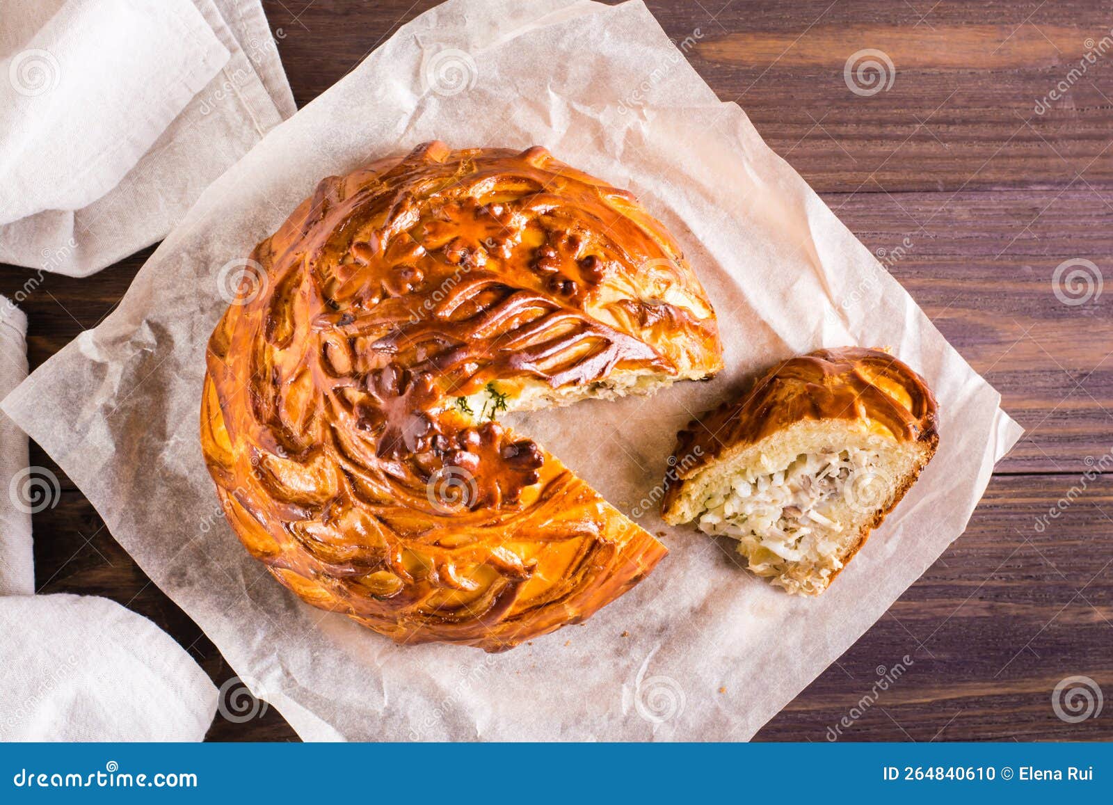 Traditional savory pie kurnik with chicken, potatoes and rice. Homemade  baking. Vertical view Stock Photo