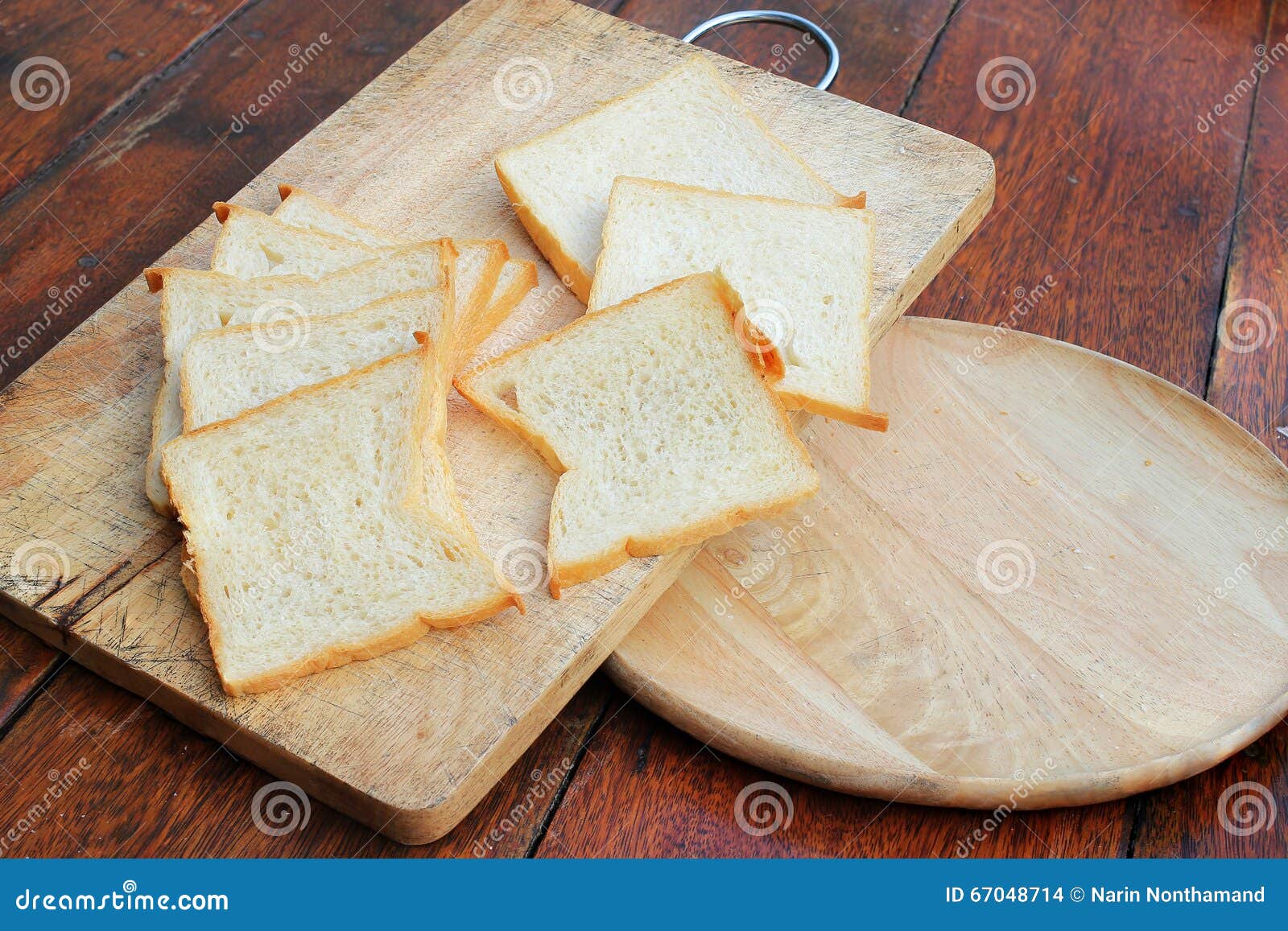 sliced white bread and french bread baguette on wooden board