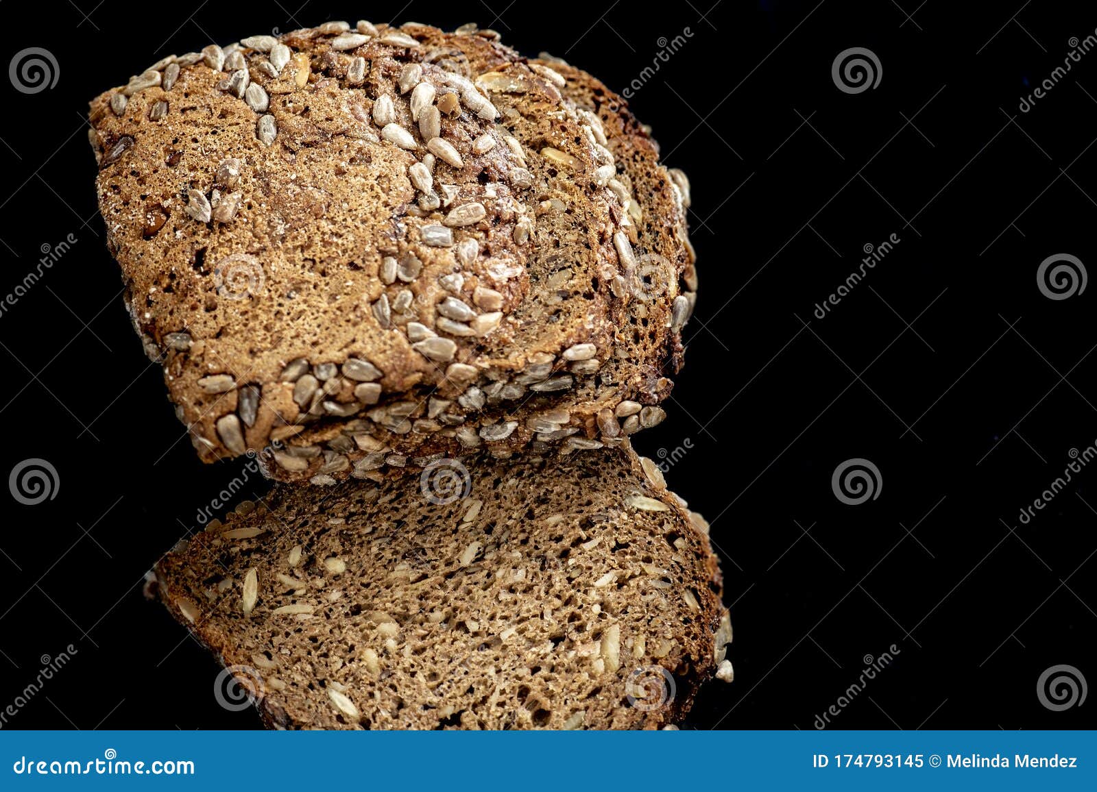 Sliced Whole Wheat, Low in Carbohydrate Bread on Black Background Stock