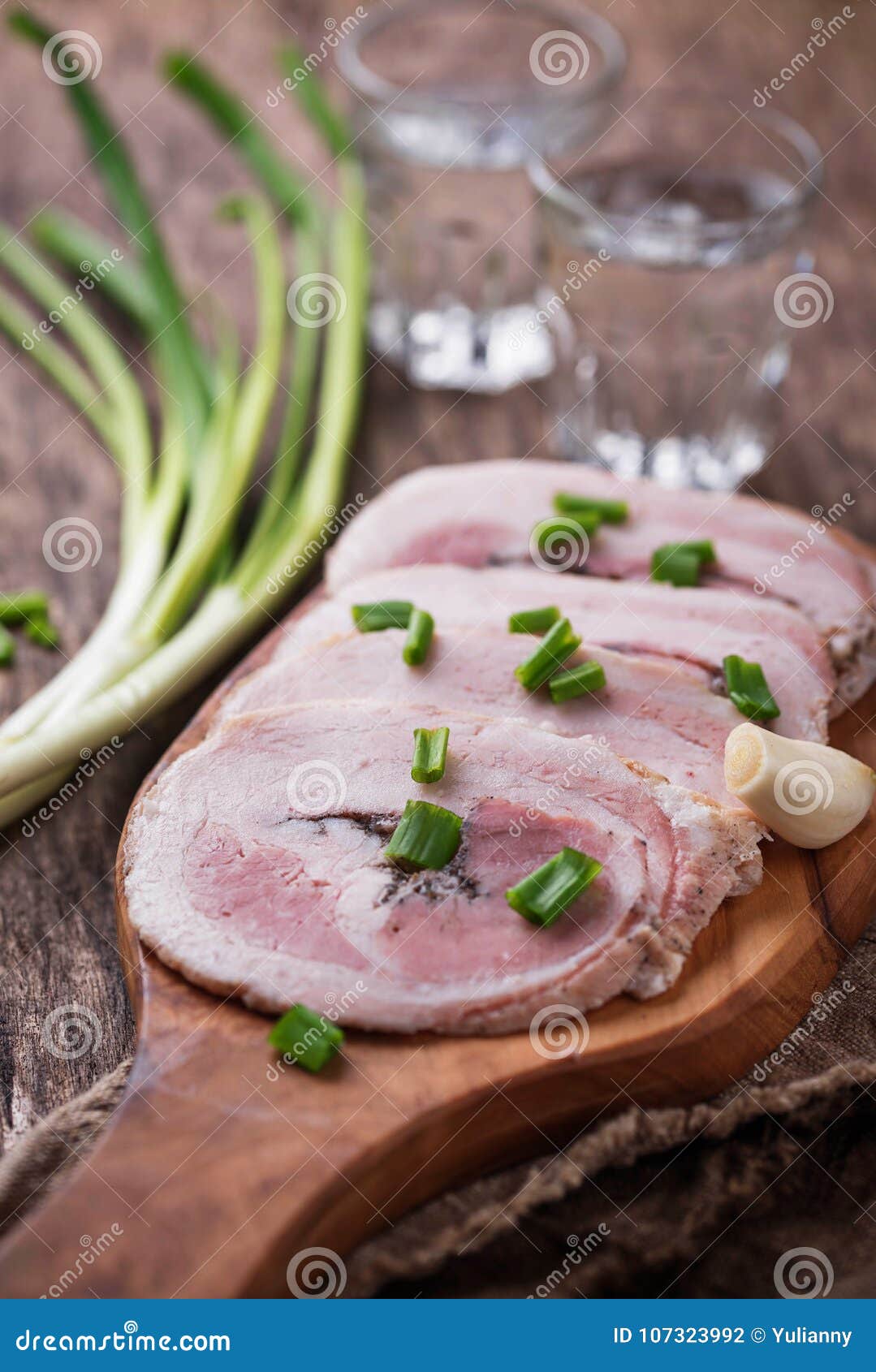 slices of bacon with green onion and garlic