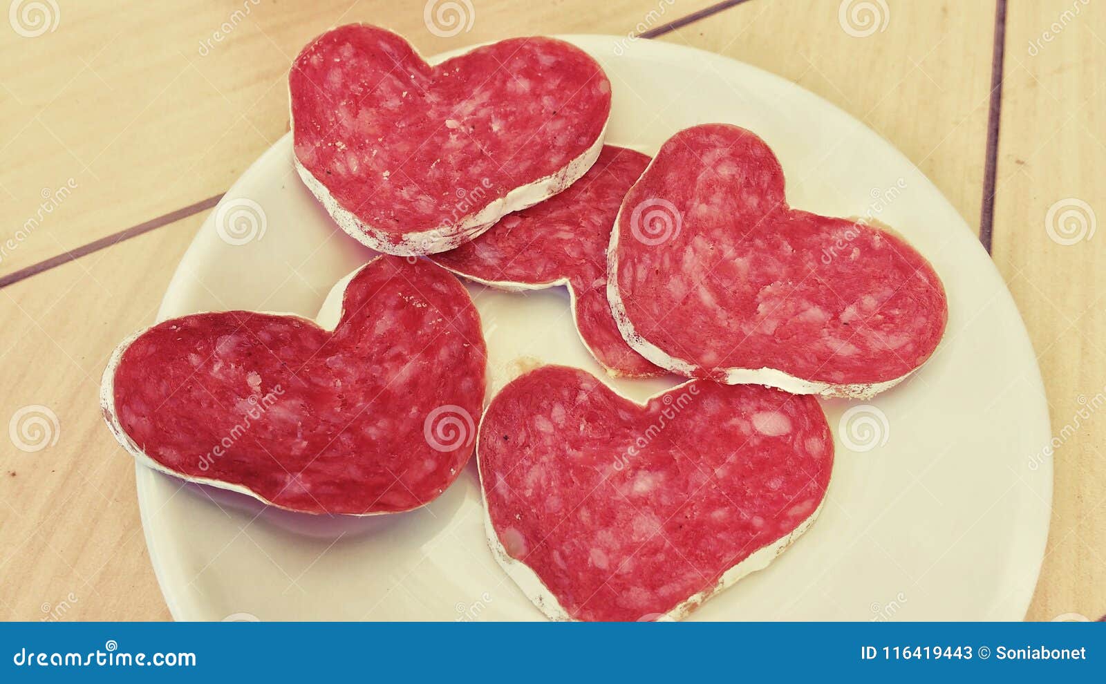 Slices of Heartshaped Sausage on a Plate Stock Image Image of