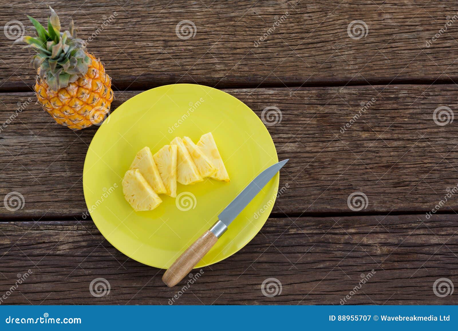 Slices of Pineapple in Plate on Wooden Table Stock Image Image of