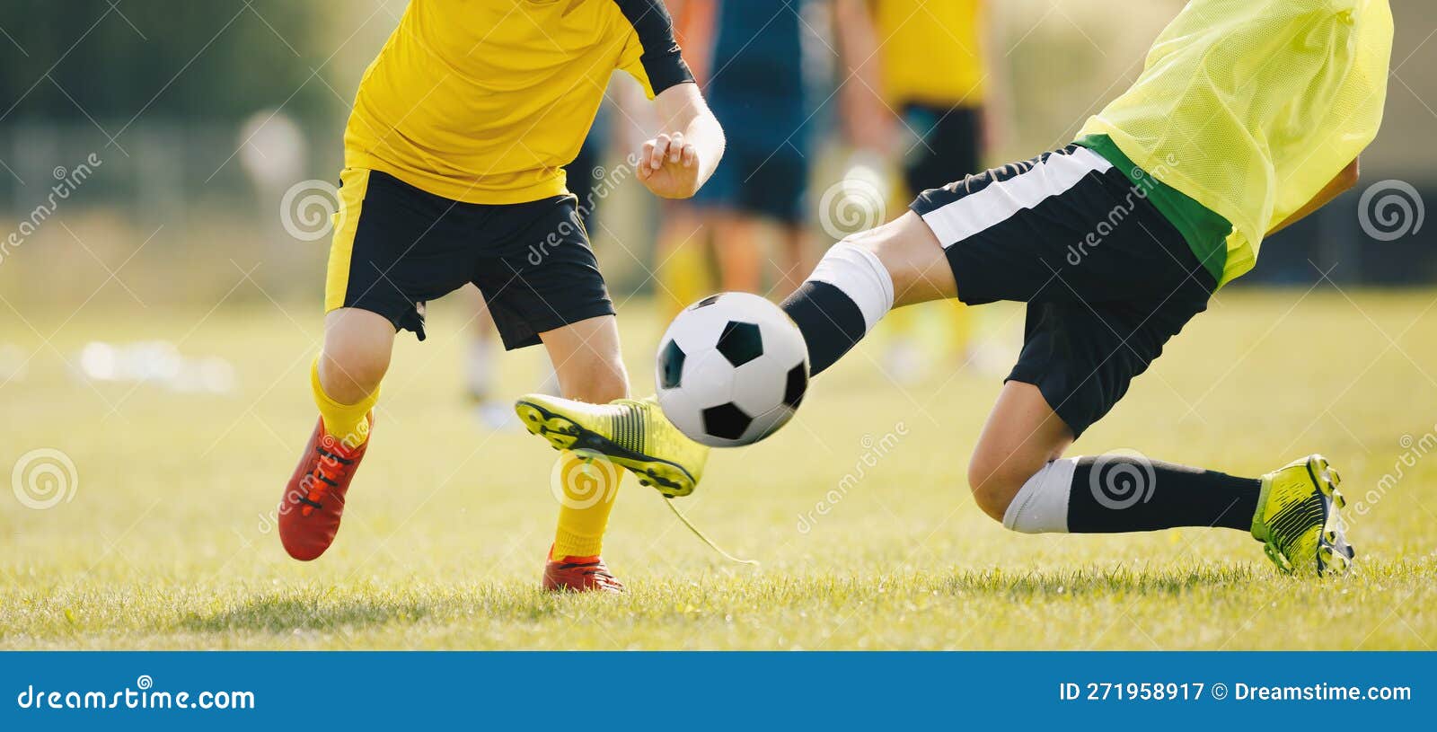 Slide Tackle in Soccer Match. Two Young Soccer Players in a Duel Compete  for Ball Stock Image - Image of goal, offense: 271958917