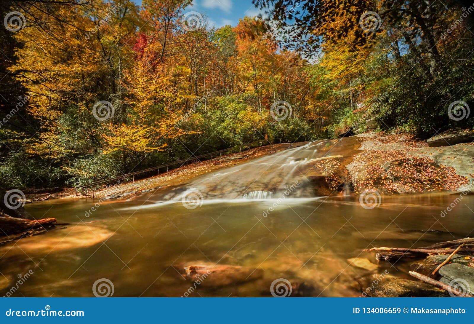 sliding rock falls in the appalachians of north carolina in late autumn with fall color foliage