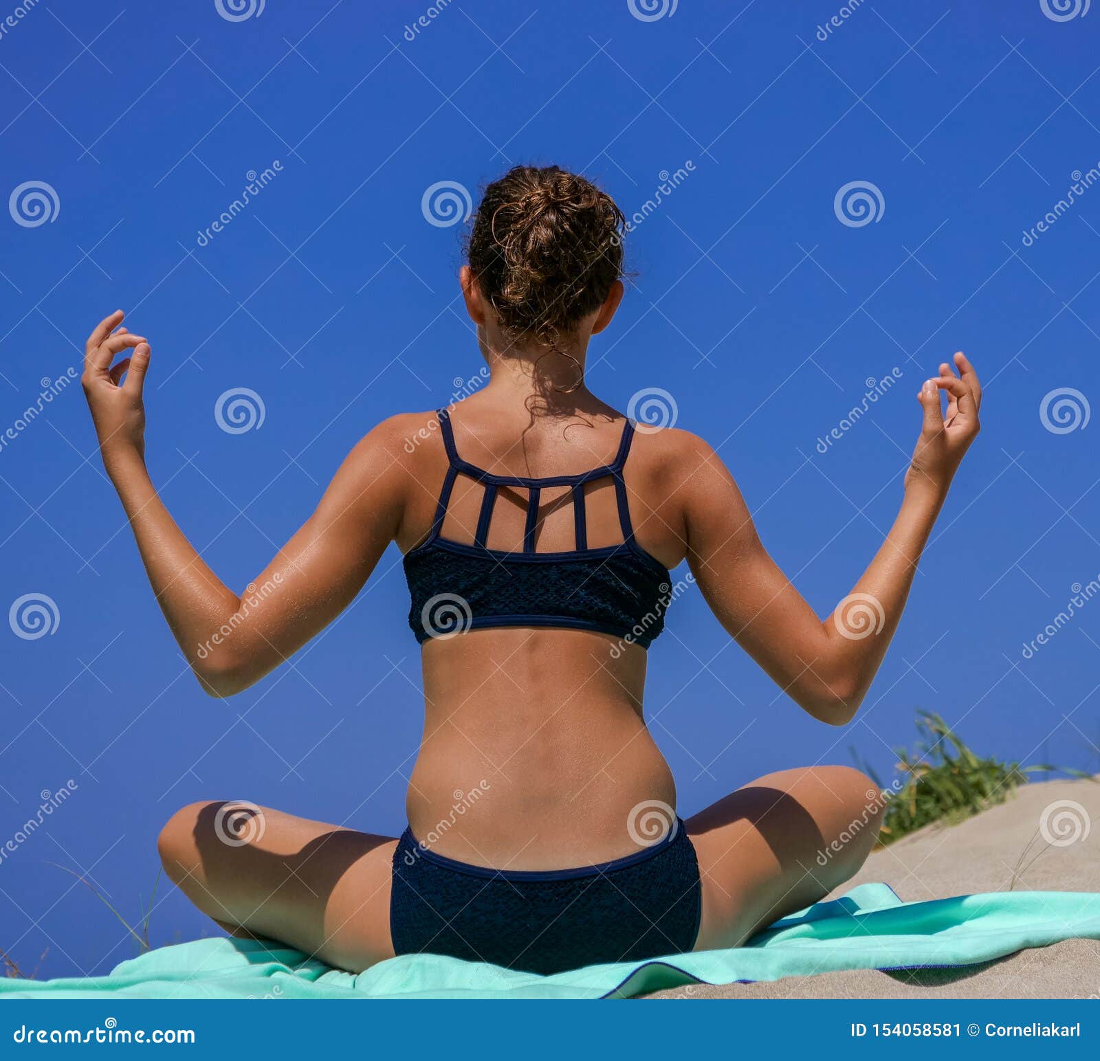 Slim and Athletic Girl in a Black Bikini Doing Yoga Pose, Calisthenics,  Fitness Training, Workout on a Beach with Blue Sky, Stock Image - Image of  back, relaxed: 154058581