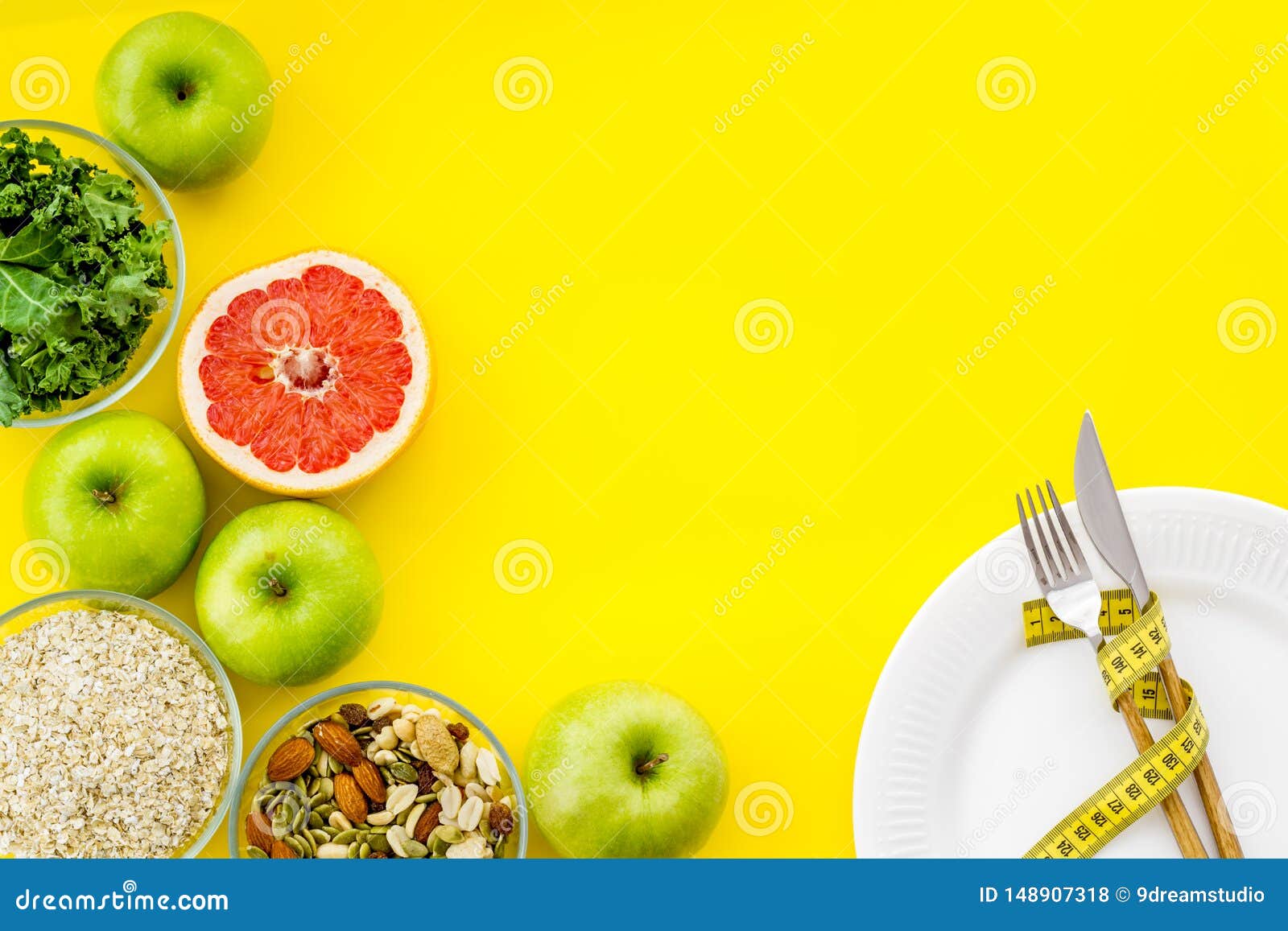Download Slim Concept With Flatware, Fruits, Oats And Measuring Tape On Yellow Background Top View Mockup ...