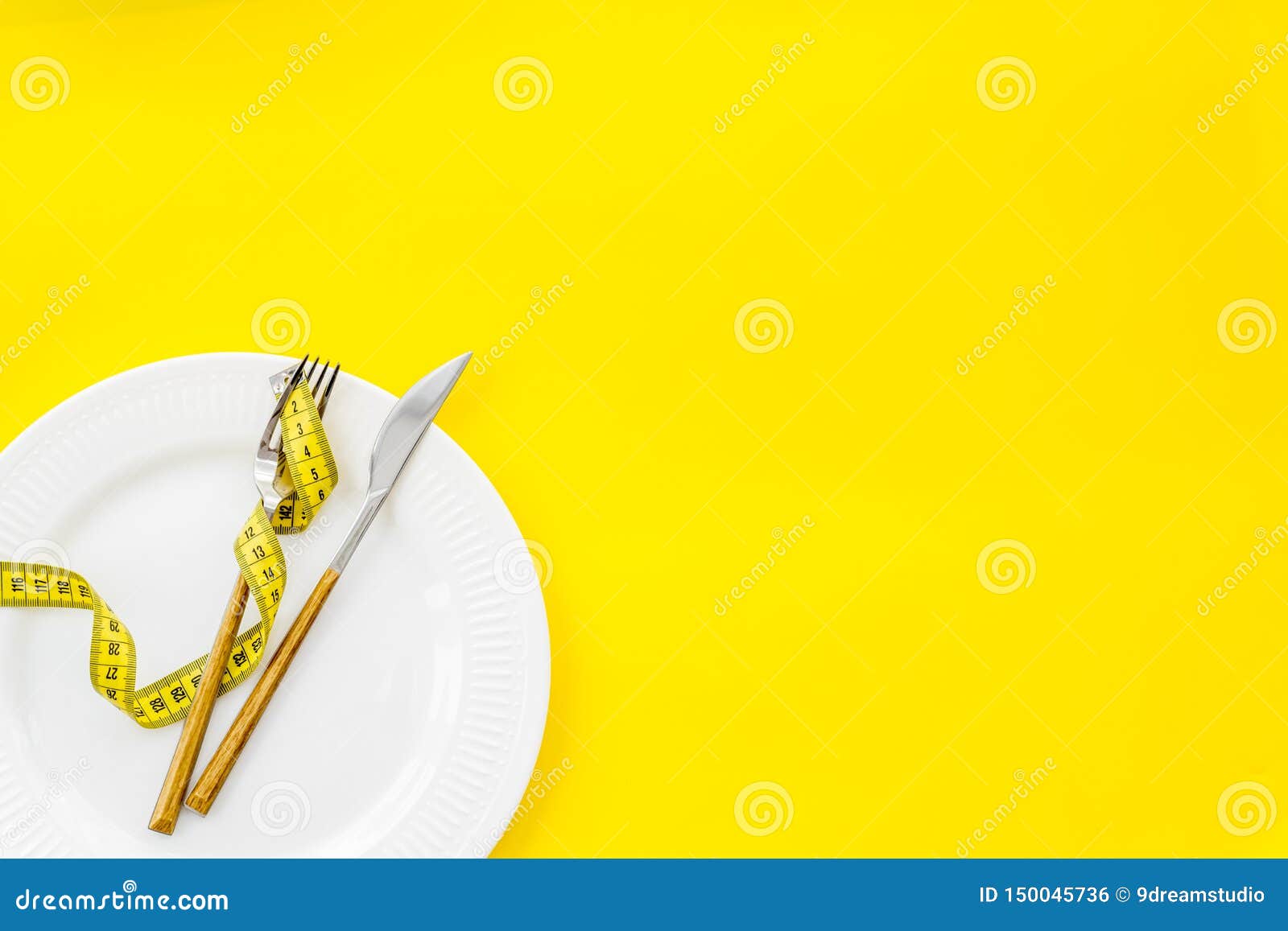 Download Slim Concept With Plate, Flatware And Measuring Tape On Yellow Background Top View Mockup Stock ...