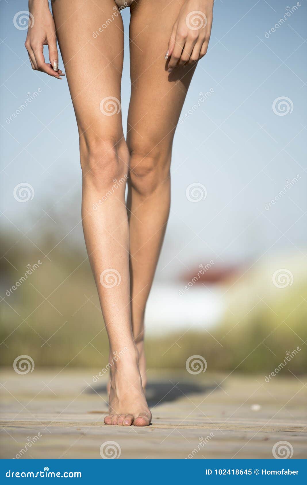 Slim Female Legs Wearing Bikini and Walking Stock Image - Image of