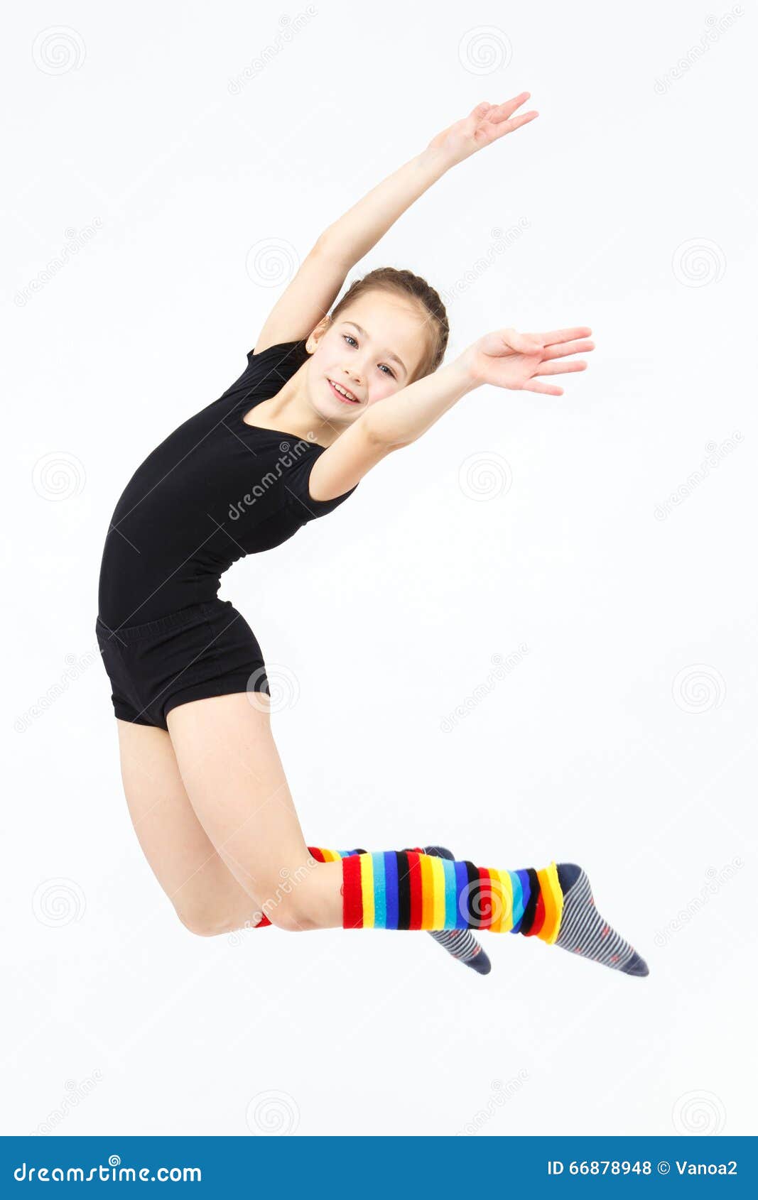 Slim Teen Girl Doing Gymnastics Dance in Jumping on White Stock