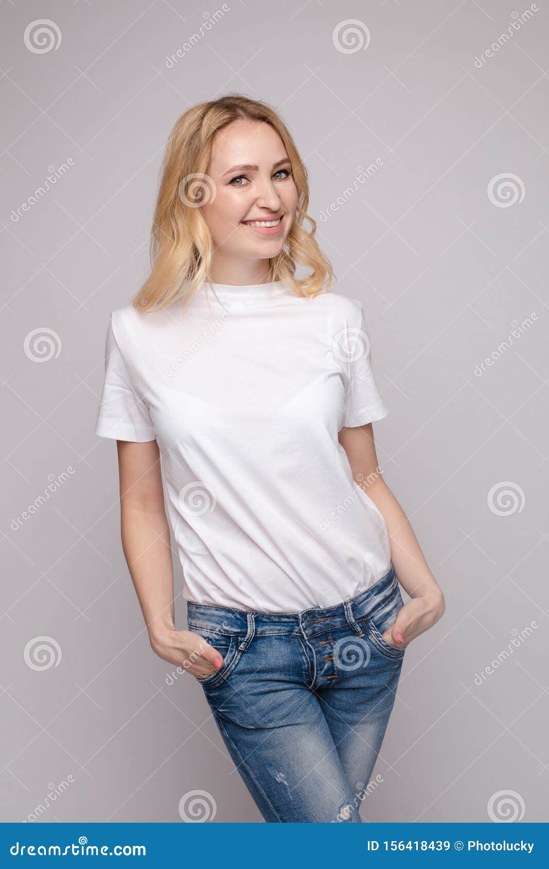 Slim Woman Wearing White Shirt and Jeans Standing Steady Stock Image ...