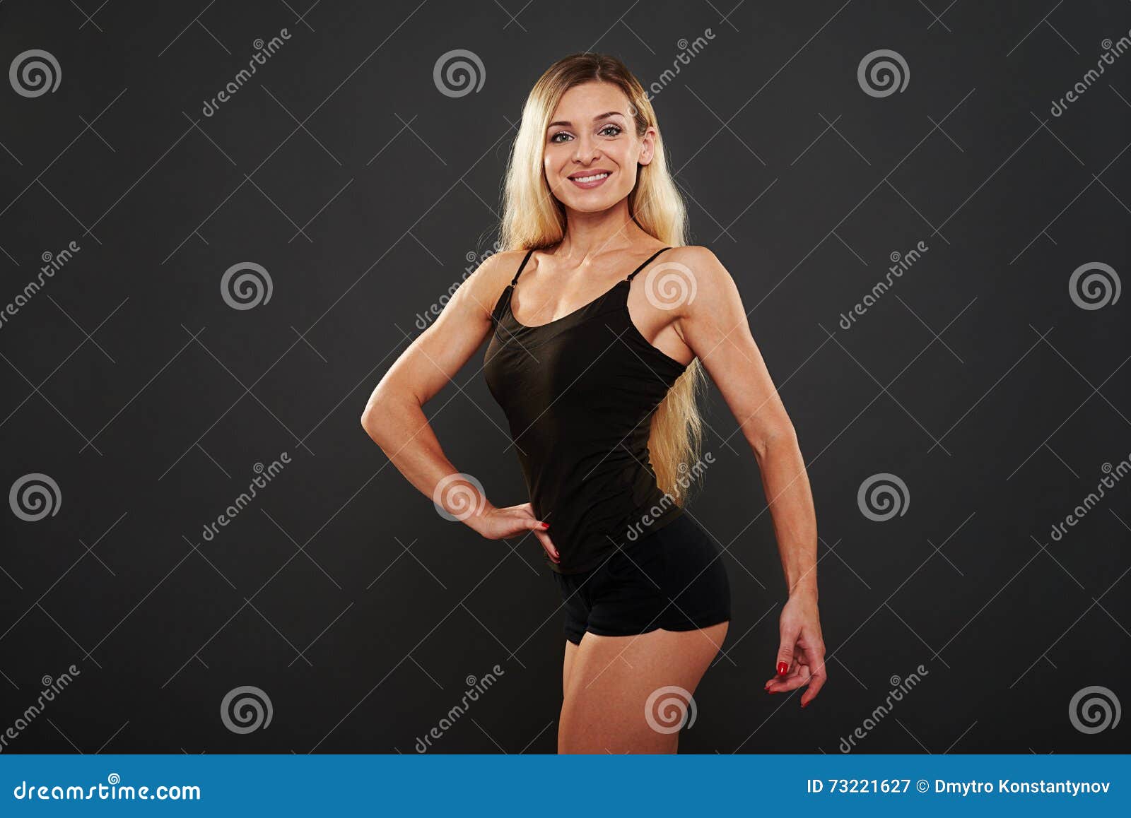 Slim Woman With Well Trained Body Over Black Background Stock Image