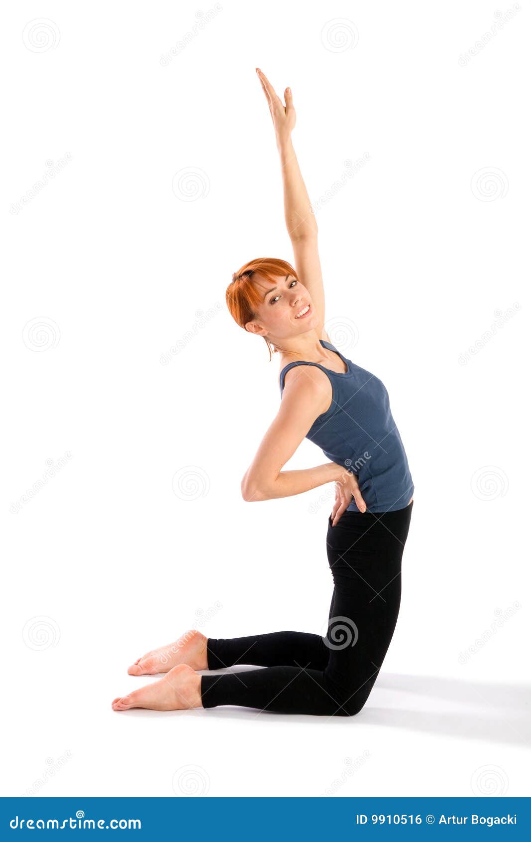 Young smiling woman in one hand Ustrasana camel yoga pose. Slim