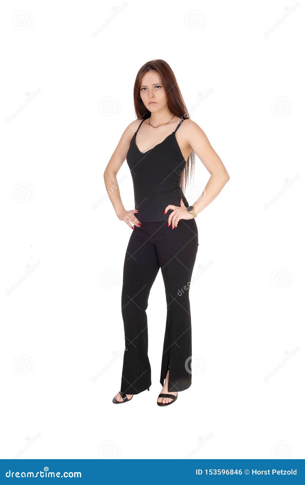 Slim Young Woman Standing in a in Black Outfits Hands on Hip Stock ...
