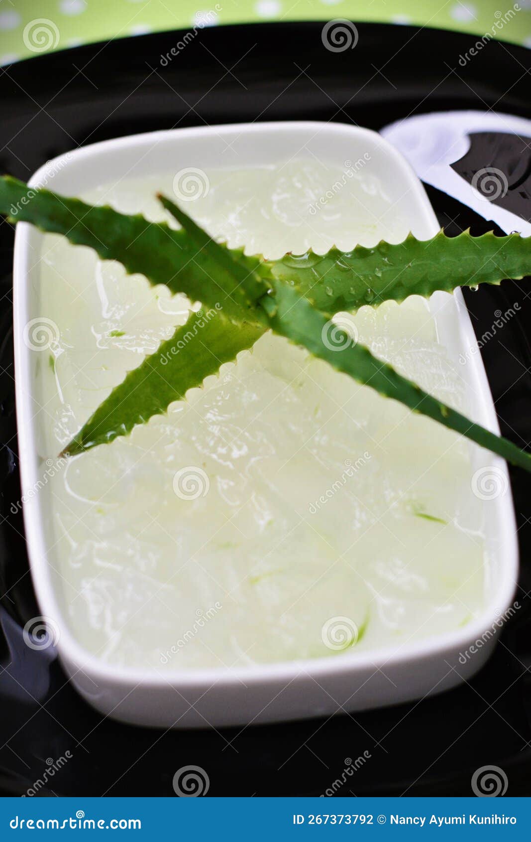 aloe vera and its juice taken from the leaves in the bowl