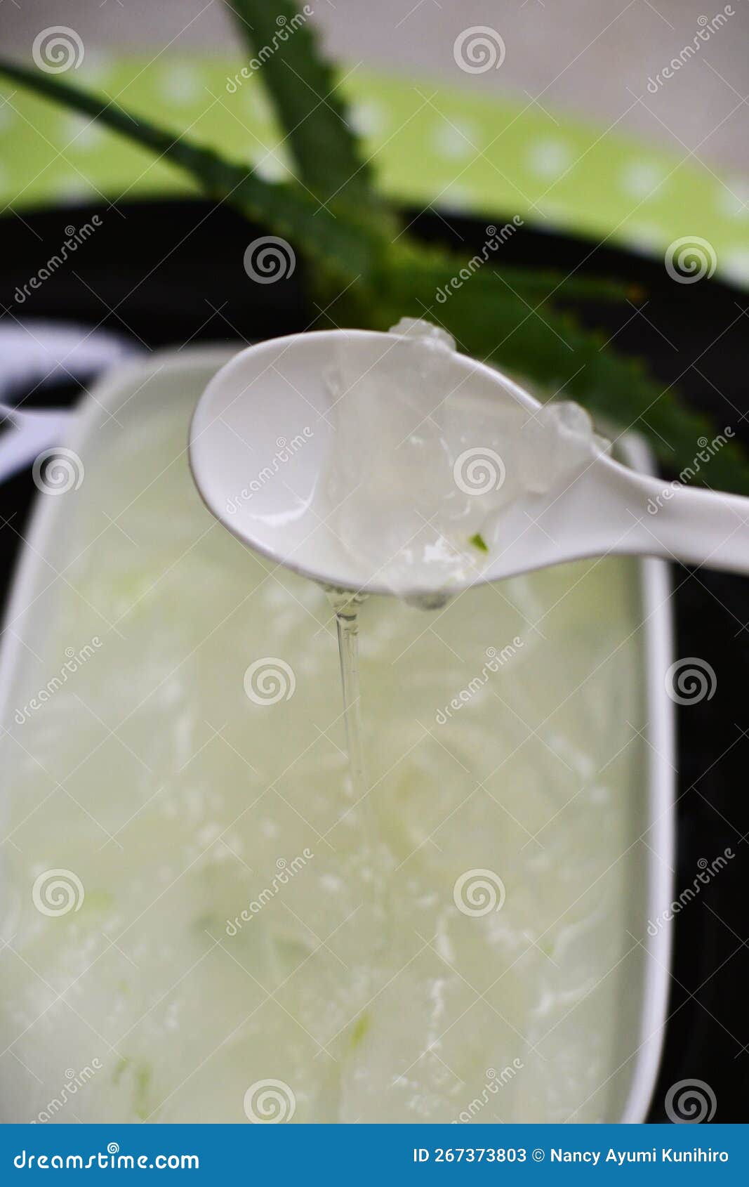 aloe vera slime sliding off the spoon