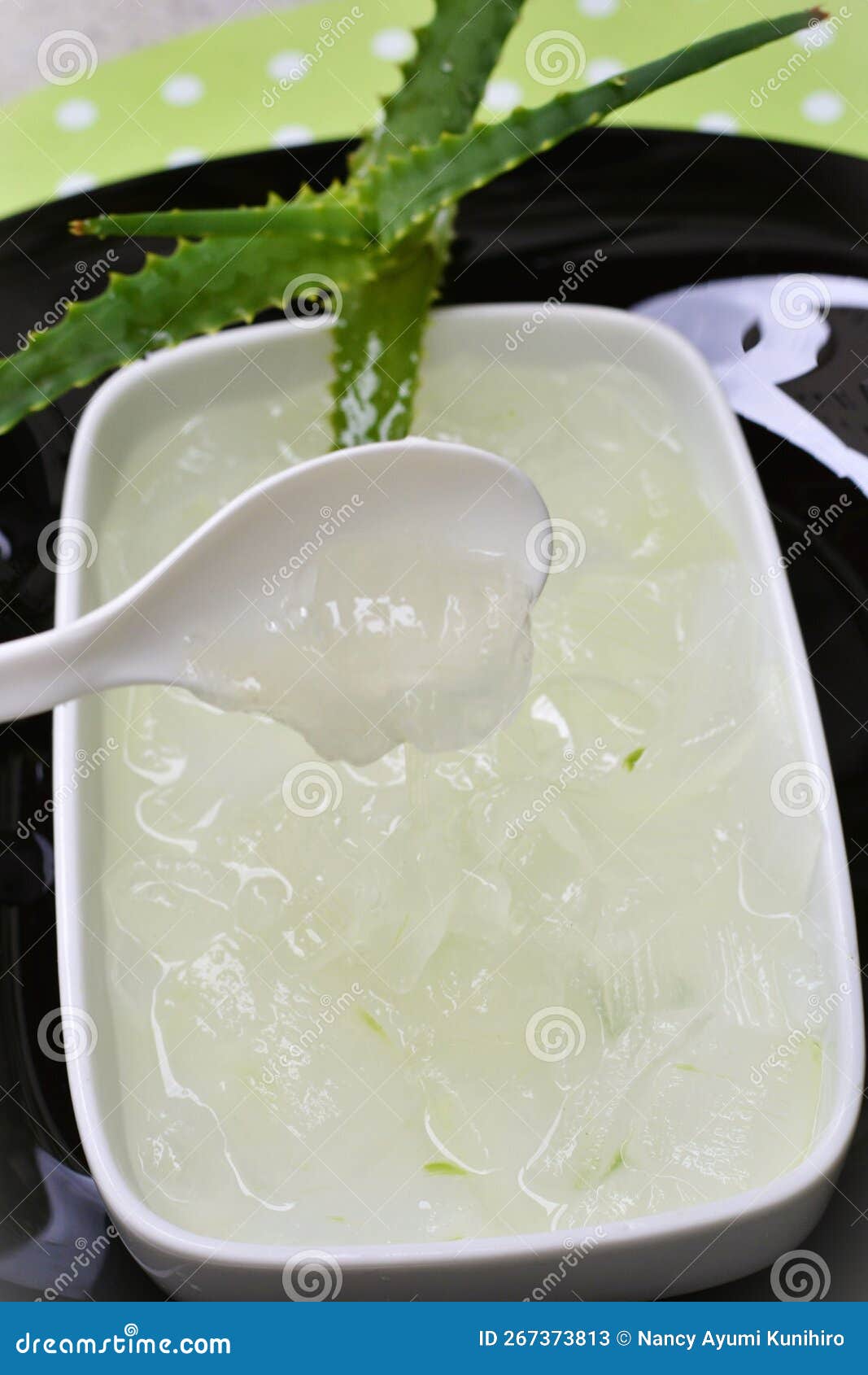 white bowl with juice and slime taken from aloe vera