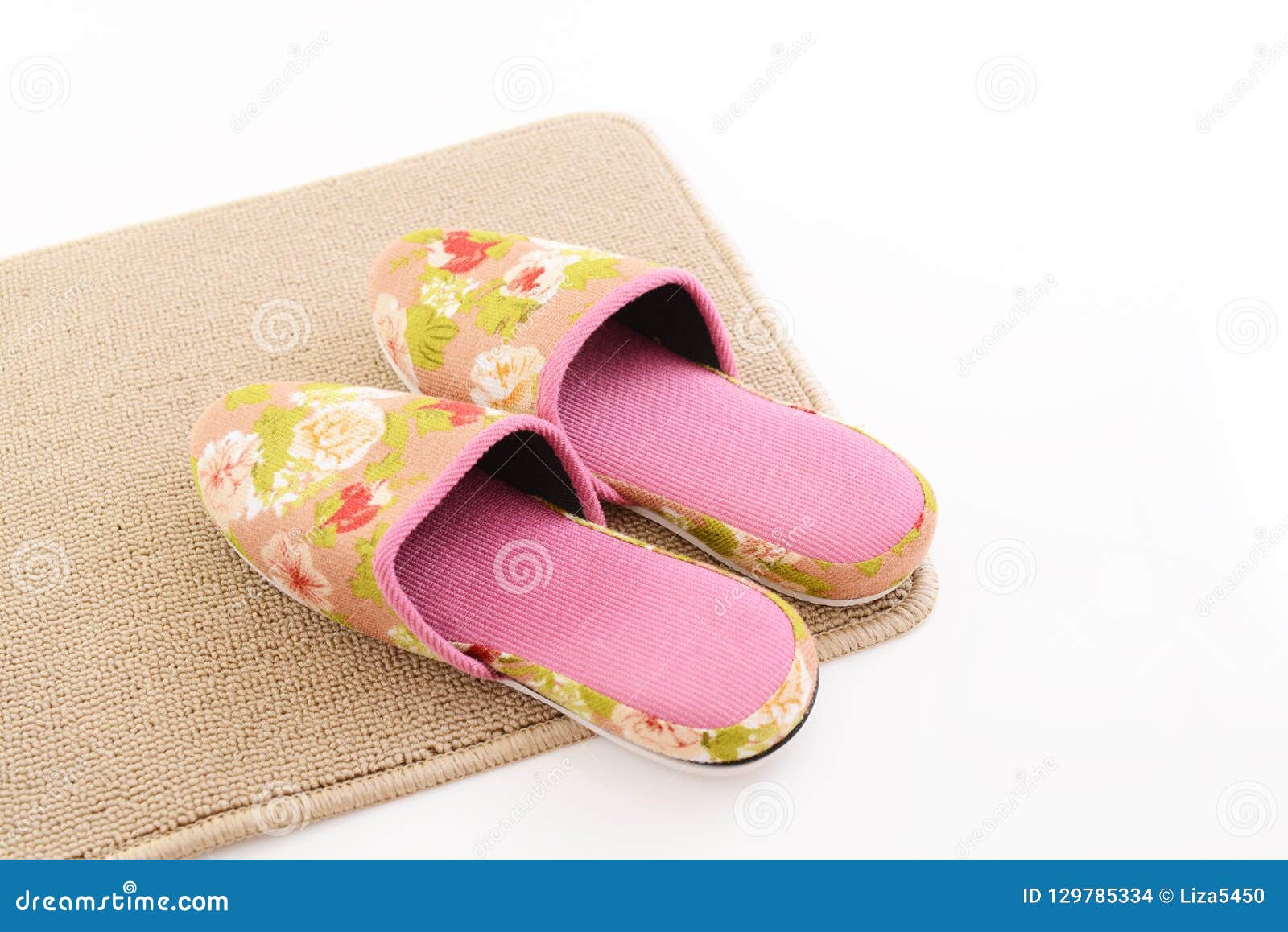 Slippers on the mat stock photo. Image of pair, home - 129785334