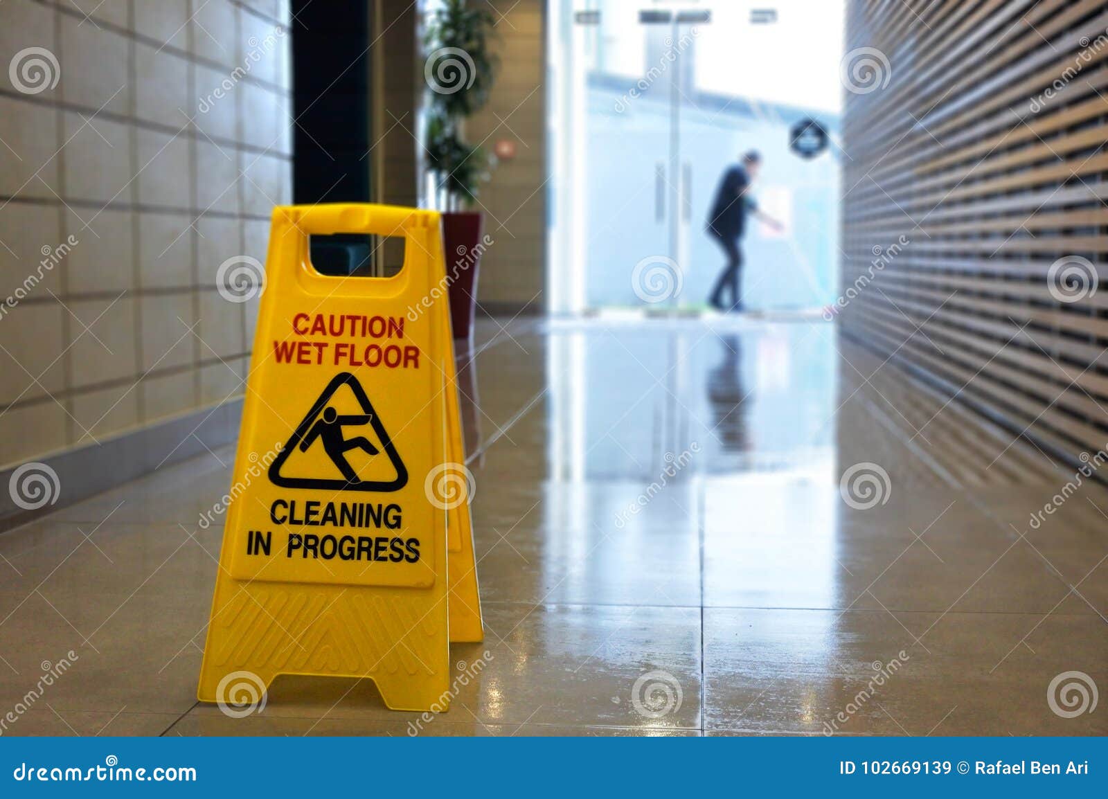 slippery floor surface warning sign and  on a wet floor