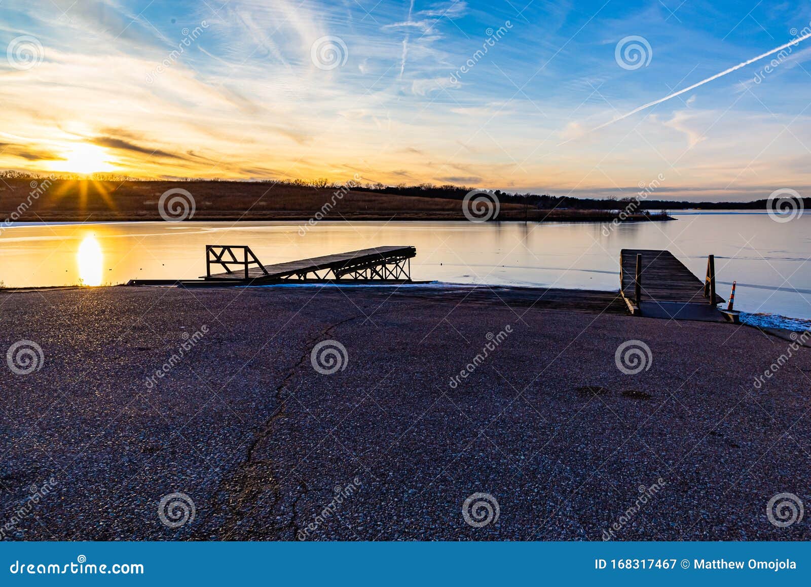 slipway or boat ramp on ed zorinsky lake at sunset in
