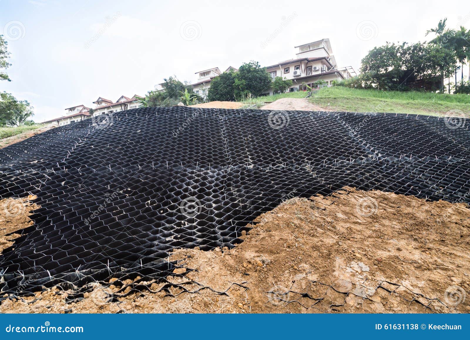 slope erosion control with grids and earth on steep slope.
