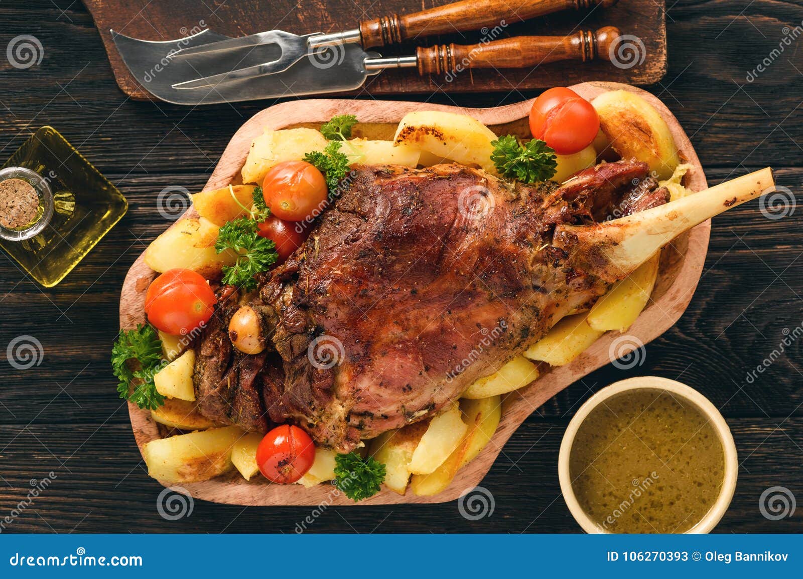 Slow Baked Lamb Leg with Potatoes and Sauce. Stock Image Image of