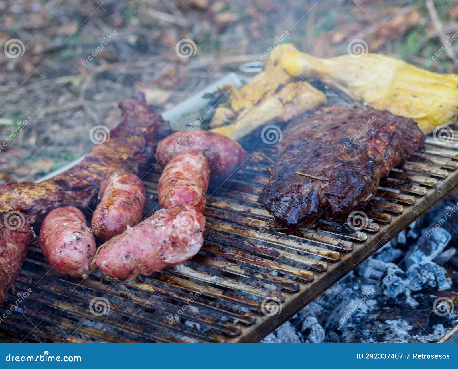 slow grilling chorizo sausages , chicken quarters, skirt and flank muscle steaks argentinian cuts