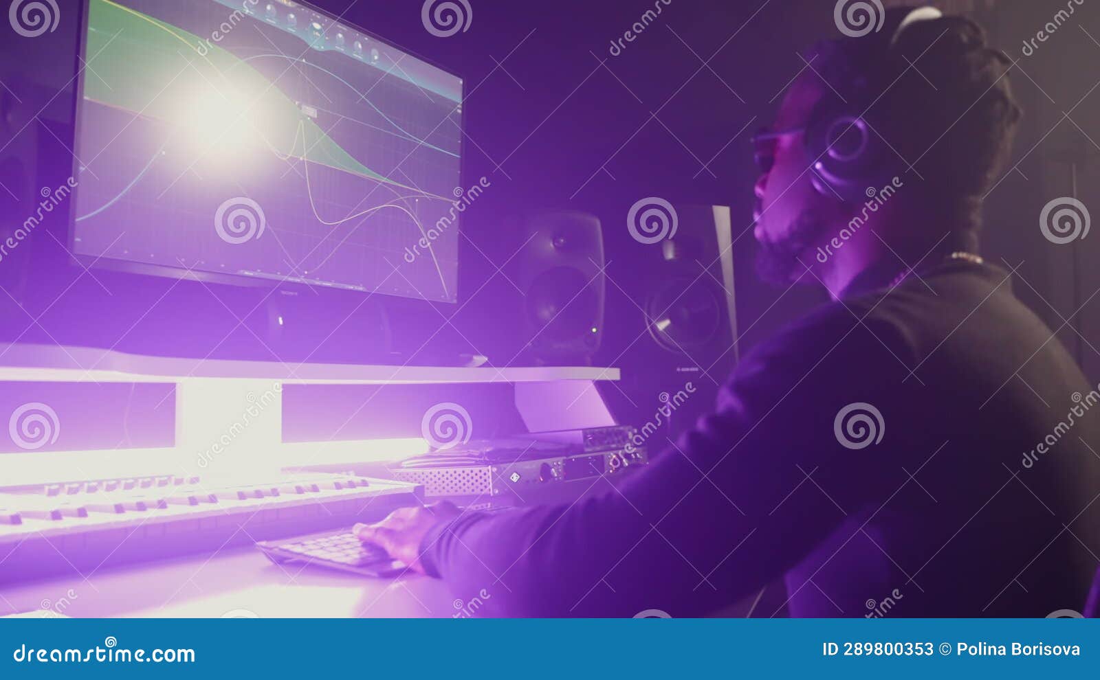 Soundman Working on Music Track Using Computer in Audio Studio Stock