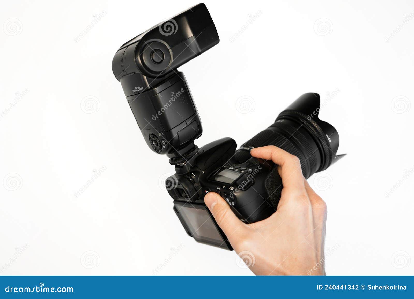 Man Holding Reflex Camera with oncamera Flash on White Background Top