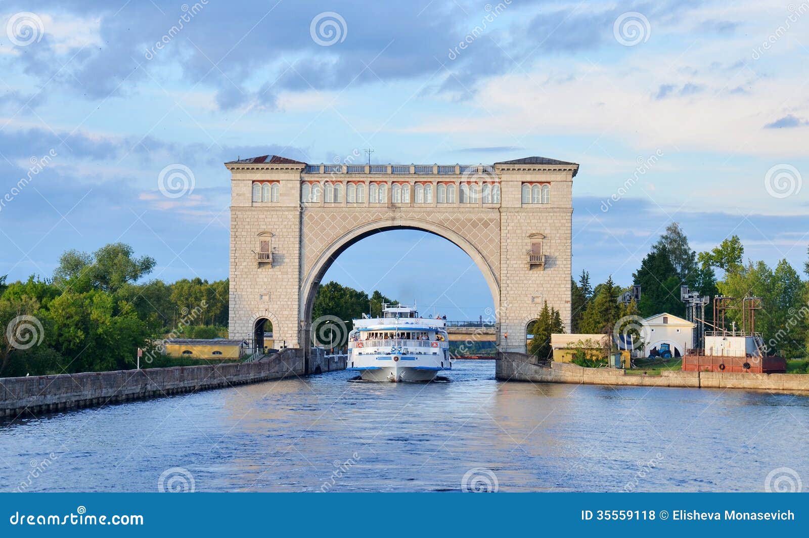 sluice gates on the river volga, russia with cruise boat