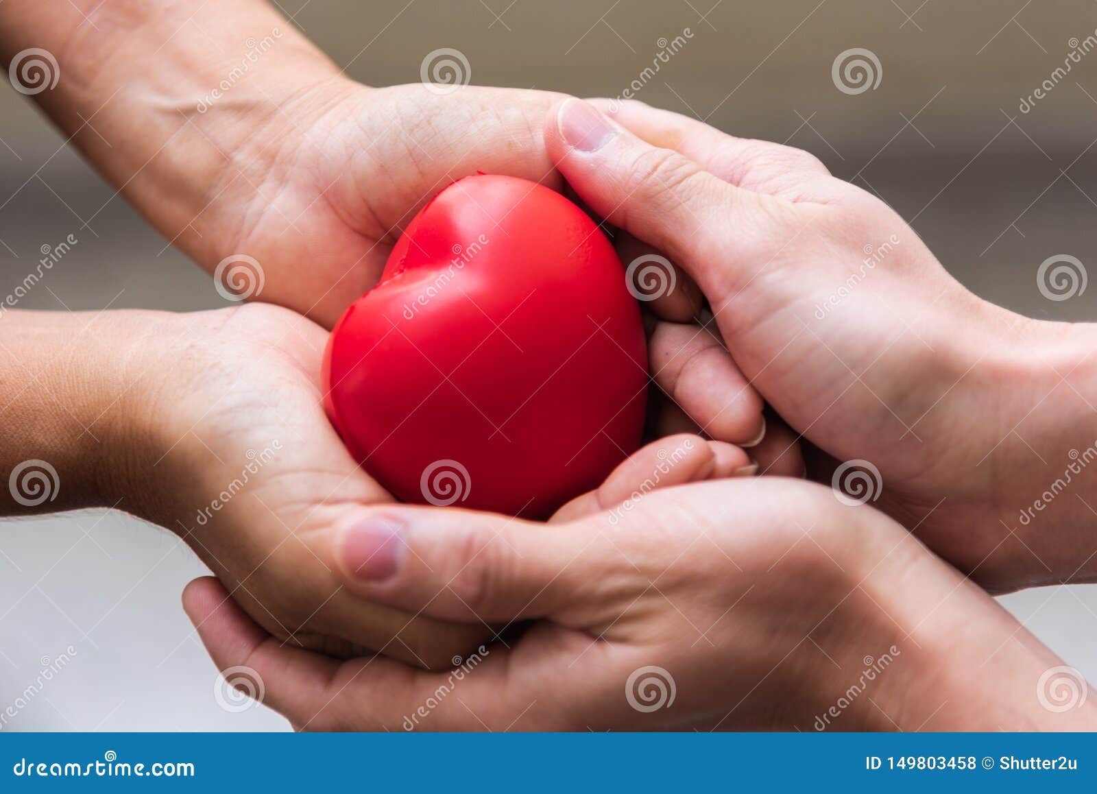Close up hand giving red heart as heart donor. Valentine day of love concept. Medical ventilator and heart donator charity
