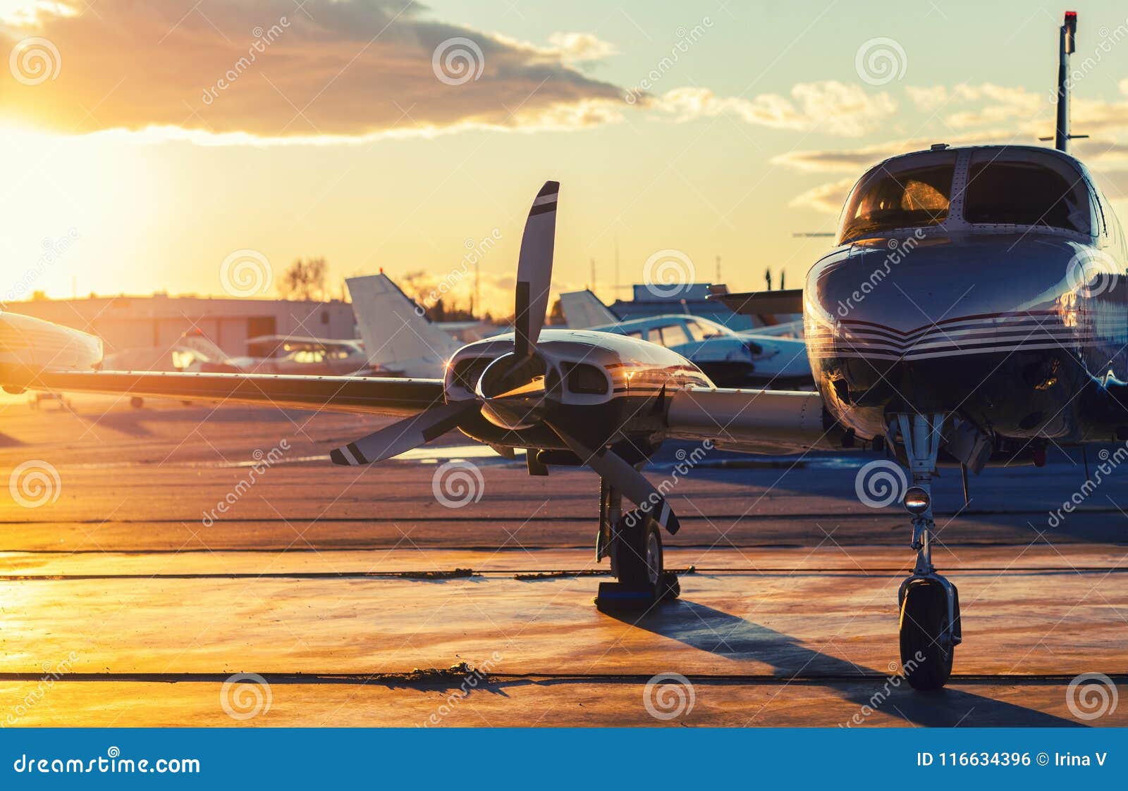 small aviation: private jet is parked on a tarmac in a beautiful