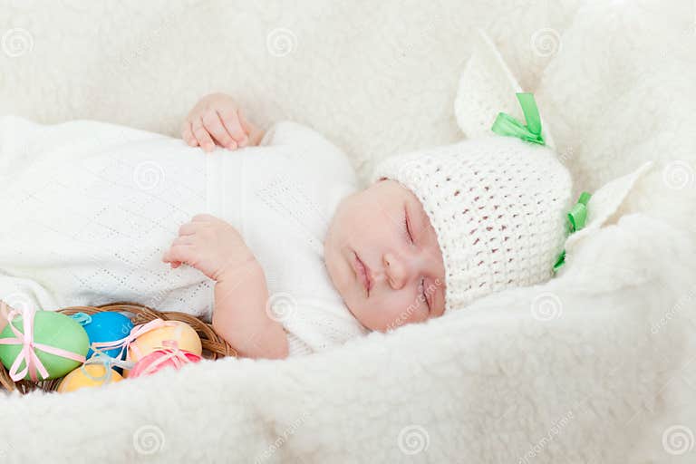 Small Baby Dressed in Easter Bunny Cap with Eggs Stock Image Image of