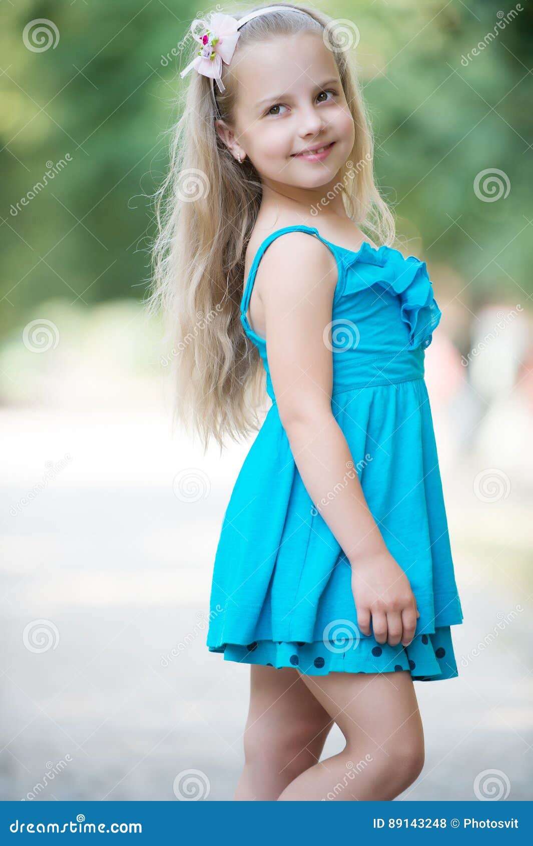 Download Small Baby Girl With Smiling Face In Blue Dress Outdoor Stock Photo - Image of emotions, dress ...