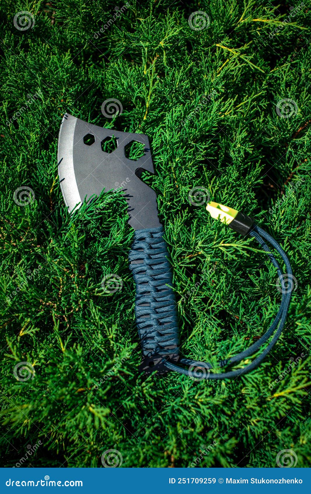 A Small Black Ax with a Paracord-wrapped Handle. a Tool for