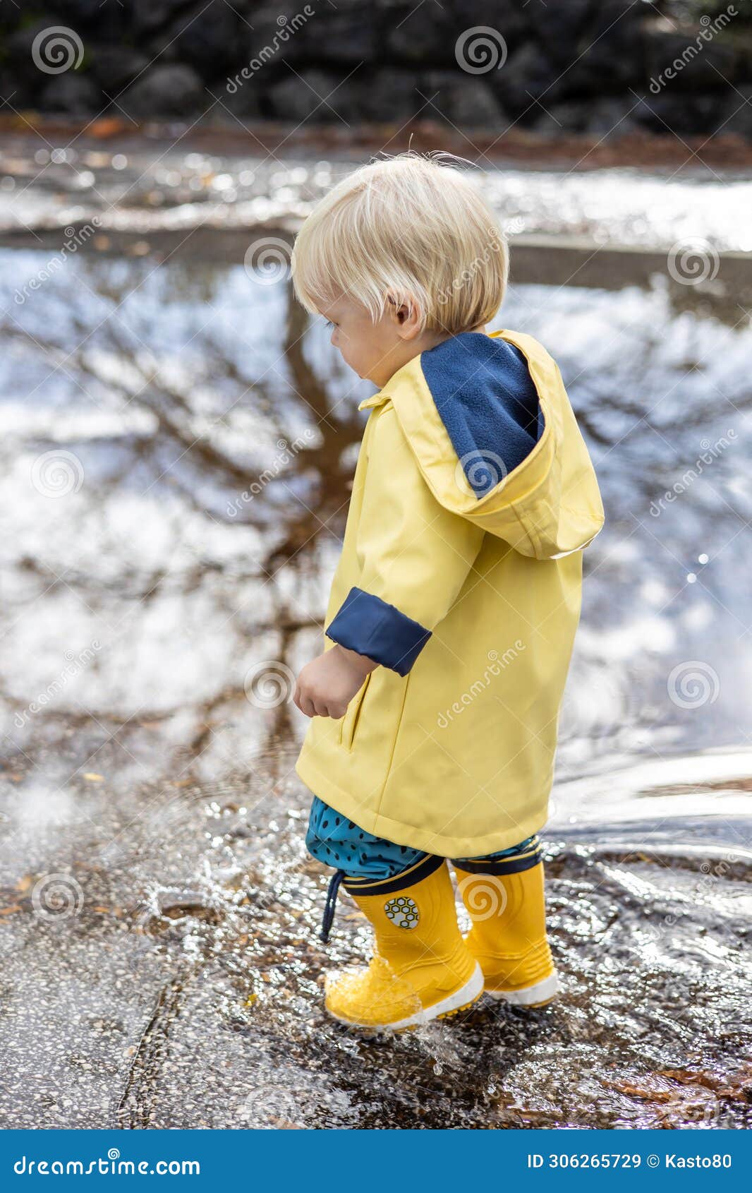 Small Blond Infant Boy Wearing Yellow Rubber Boots and Yellow ...