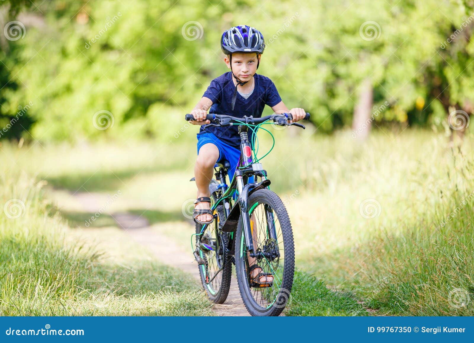 small boy riding bike