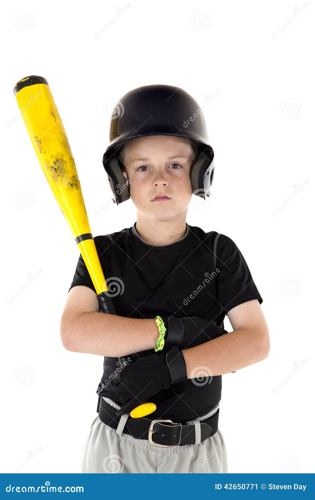 Small Boy Holding His Baseball Bat with a Serious Expression Stock