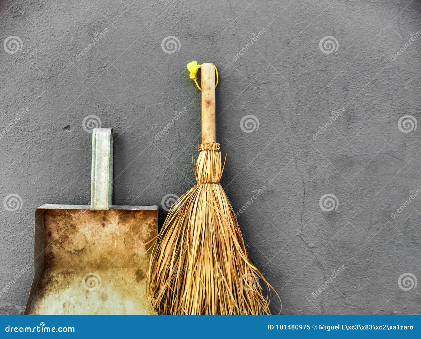 Small Broom and Dustpan on a Grey Wall Background Stock Image Image