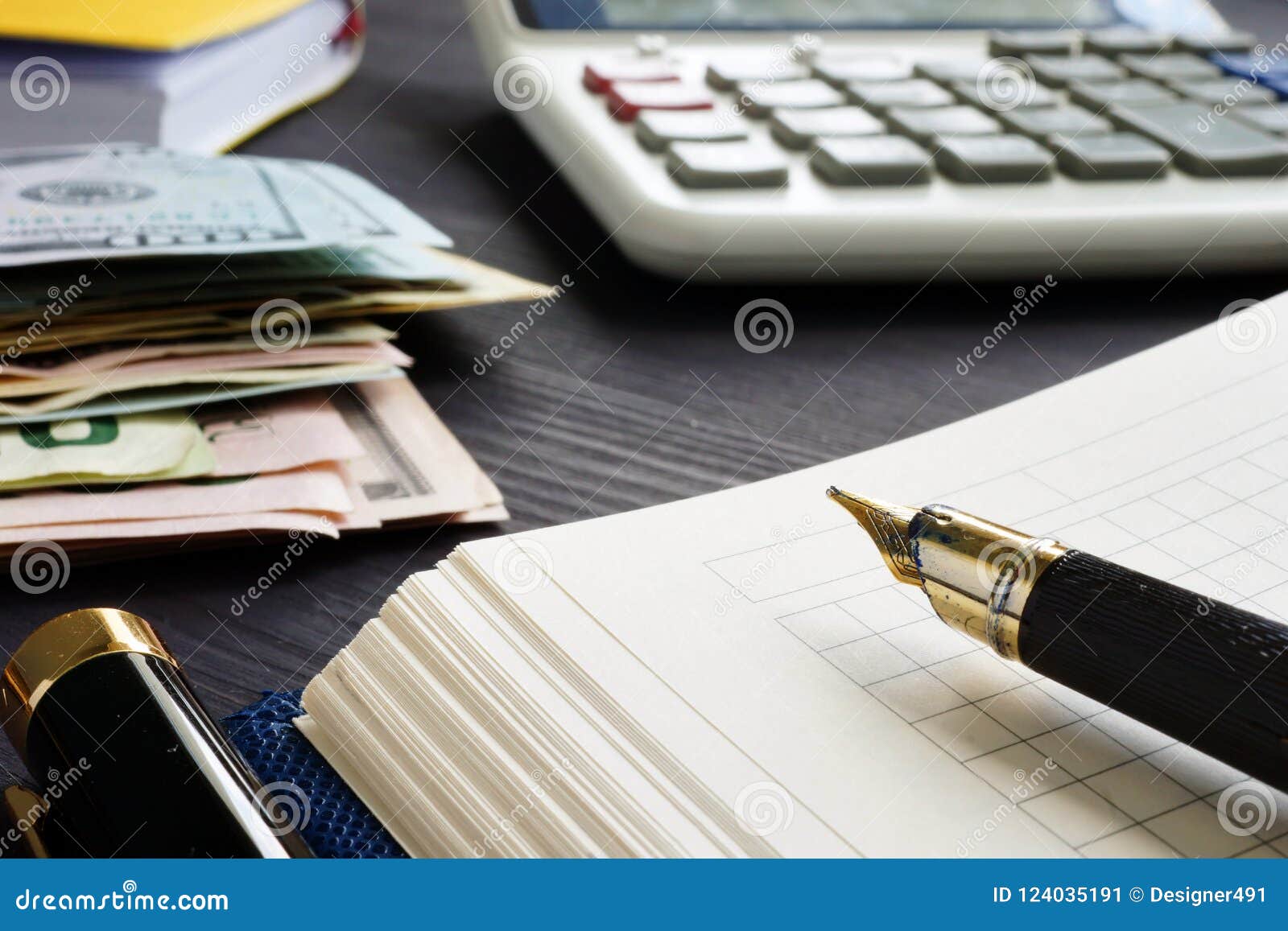 small business bookkeeping and investment. calculator and money.