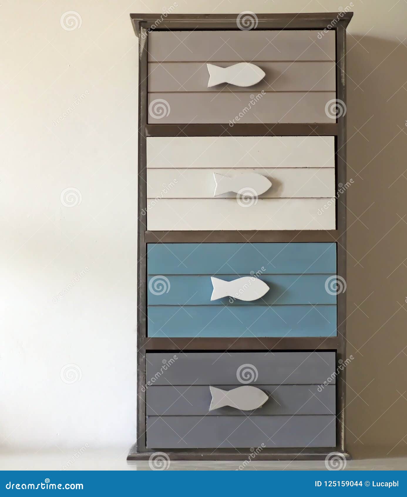 Small Chest Of Drawers With Fish Shaped Handles And Four Drawers