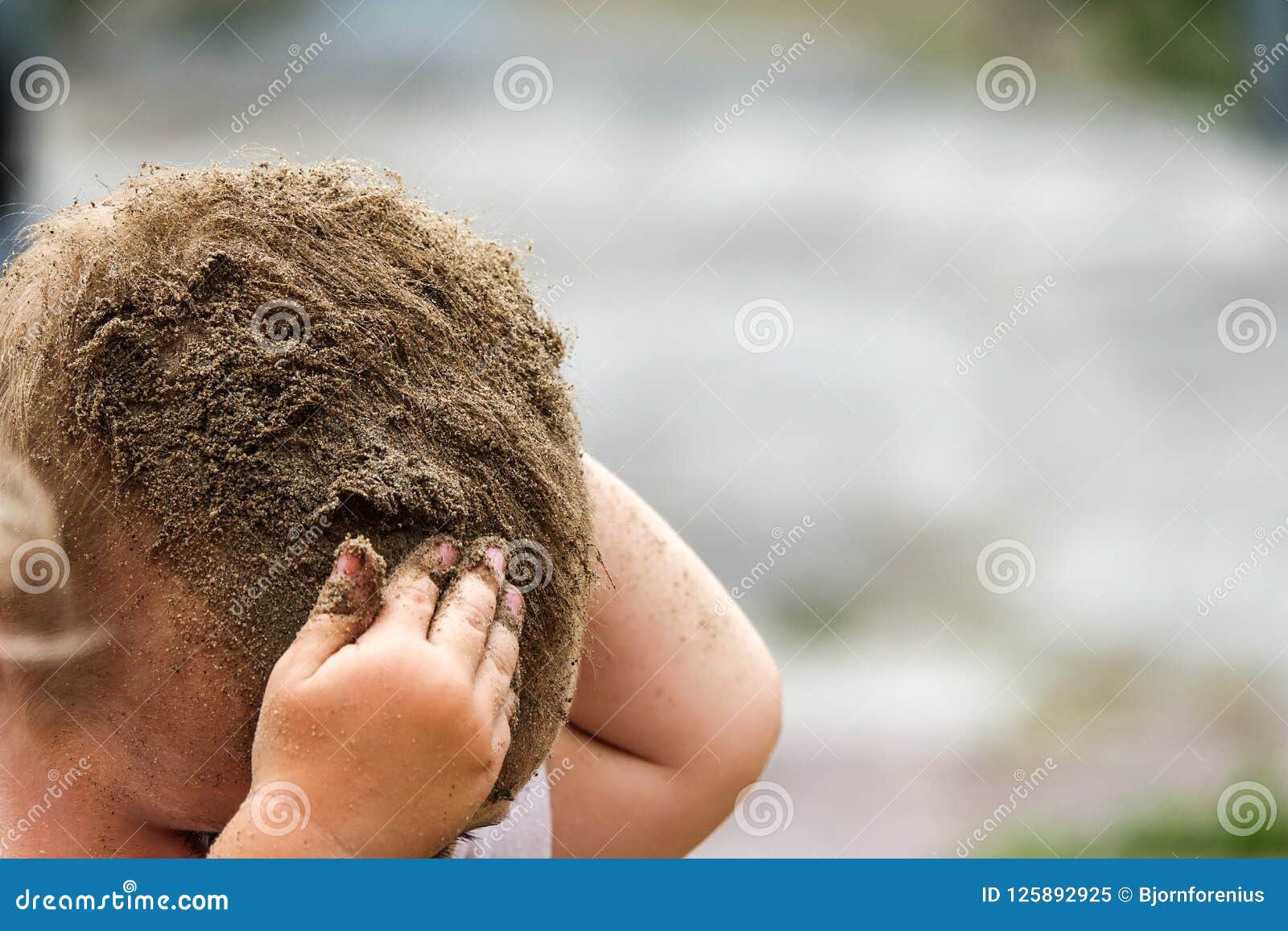 A Small Child Puts Sand and Dirt in the Hair. Stock Image - Image of puts, hair: 125892925 A Small Child Puts Sand and Dirt in the Hair. Stock Image - Image of puts, hair: 125892925