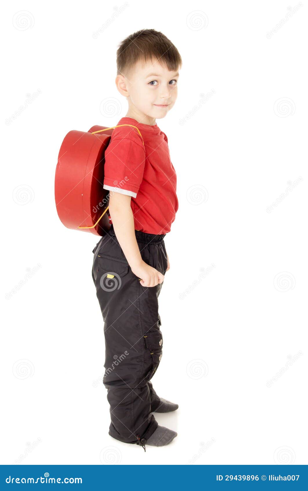 A Small Child Stand is with a Backpack in the Form of Heart Stock Photo