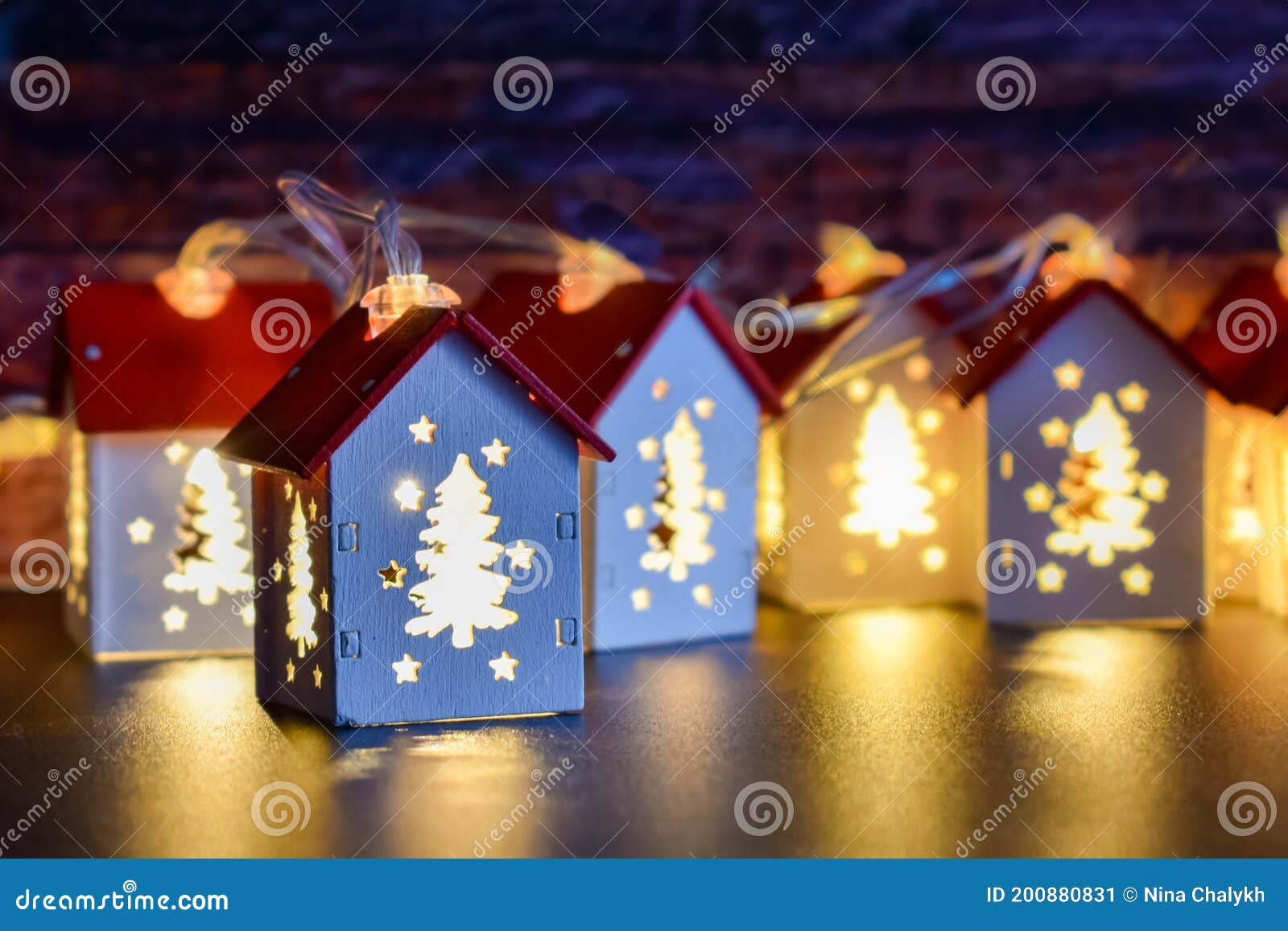 Small Christmas Houses with Christmas Tree-shaped Windows that Glow ...